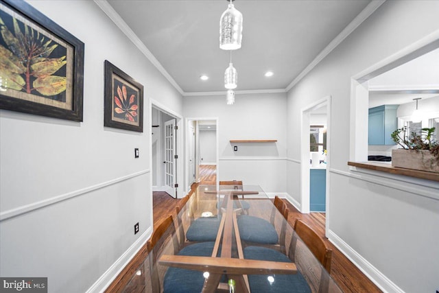 corridor featuring crown molding and dark hardwood / wood-style flooring