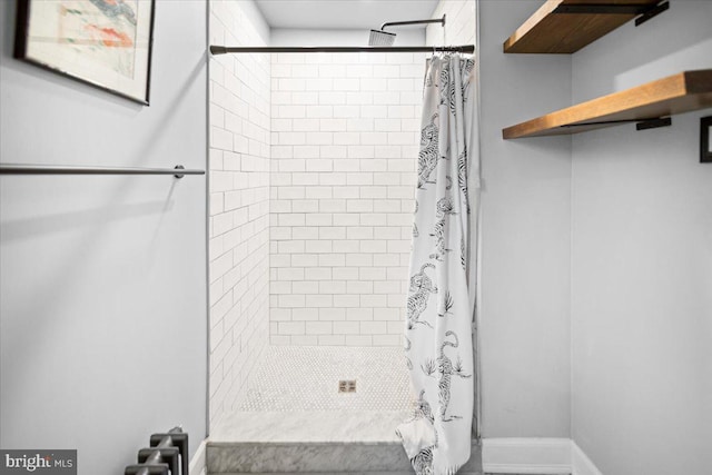 bathroom featuring a shower with curtain