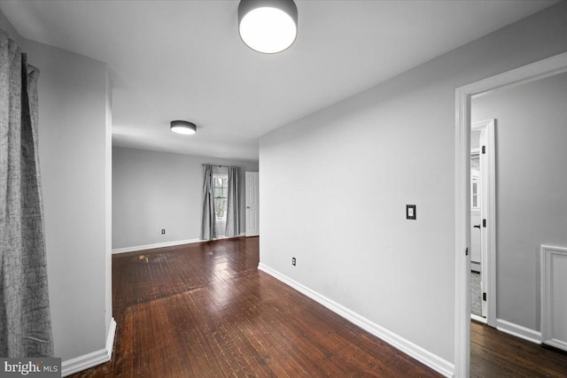 spare room featuring dark hardwood / wood-style floors