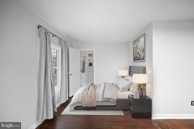 bedroom featuring dark hardwood / wood-style flooring