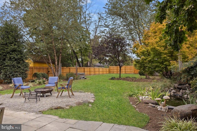 view of yard with an outdoor fire pit and a patio area