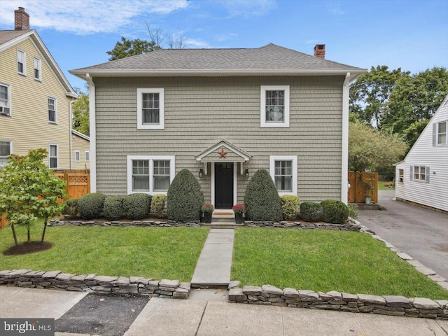 view of front facade with a front lawn