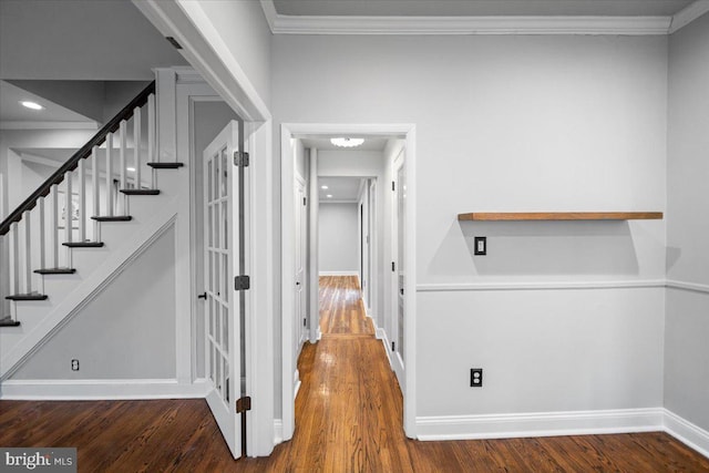 interior space with crown molding and dark hardwood / wood-style floors