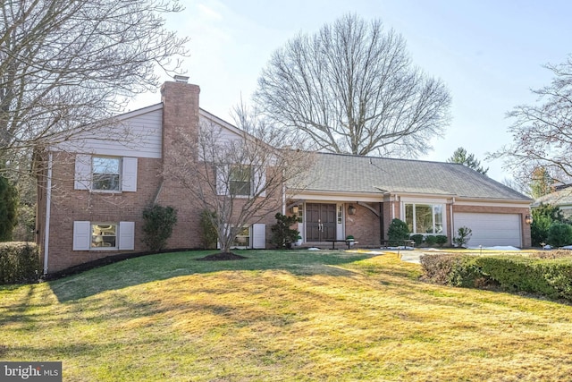 view of front of property featuring a garage and a front yard