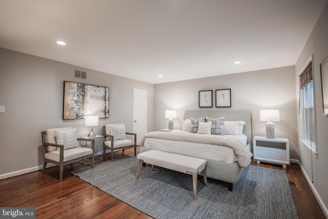 bedroom featuring dark hardwood / wood-style flooring