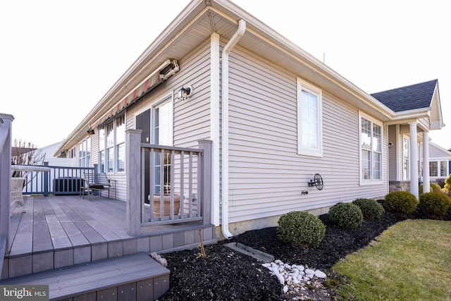 view of property exterior featuring a deck