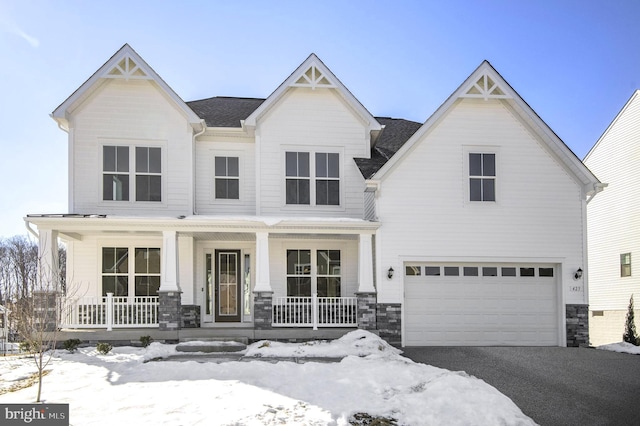 view of front of house with a garage and a porch