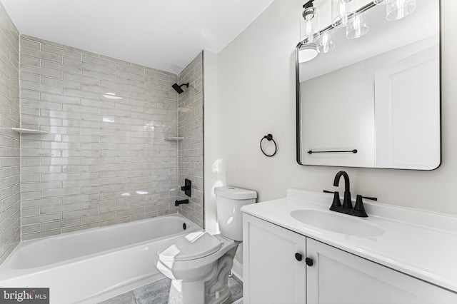 full bathroom featuring tiled shower / bath combo, vanity, and toilet