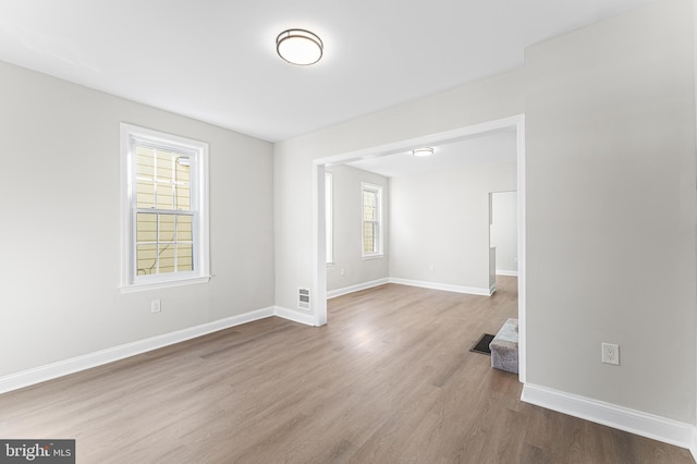 spare room with wood-type flooring