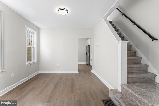 interior space with hardwood / wood-style flooring