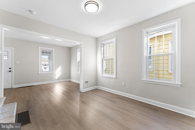 empty room featuring wood-type flooring