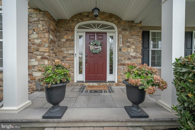 property entrance with stone siding