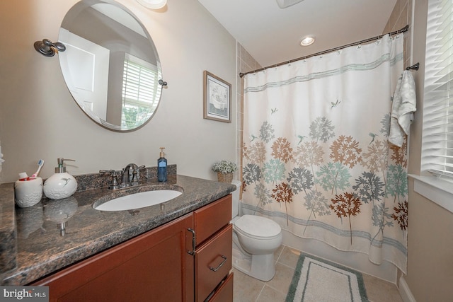 bathroom featuring toilet, shower / bath combination with curtain, vanity, and tile patterned floors