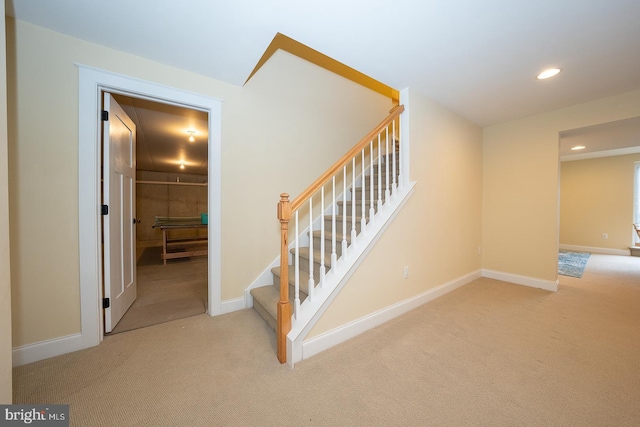 stairs featuring carpet floors, baseboards, and recessed lighting