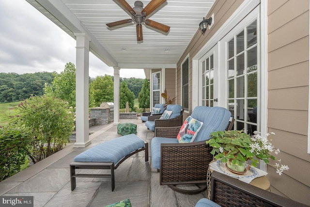 view of patio with an outdoor hangout area and a ceiling fan