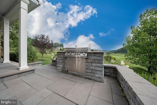 view of patio / terrace featuring grilling area and exterior kitchen