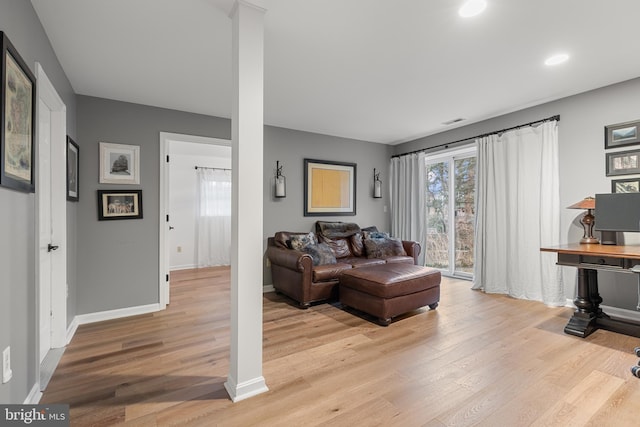 living room with light hardwood / wood-style flooring