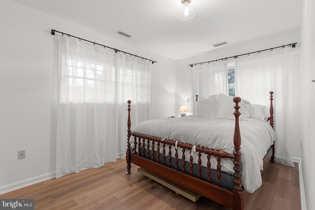 bedroom with wood-type flooring