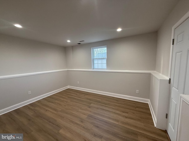 basement featuring dark wood-type flooring