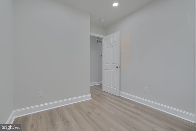 spare room featuring light wood-type flooring