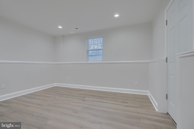 spare room with light hardwood / wood-style floors