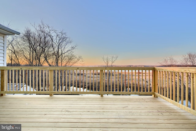 deck at dusk with a water view