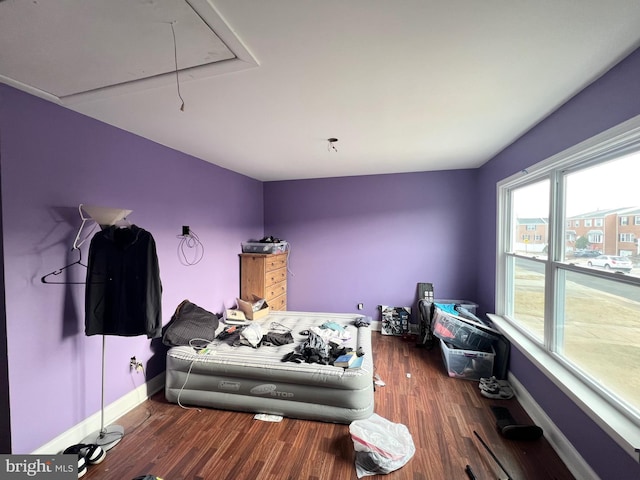 bedroom featuring dark hardwood / wood-style flooring