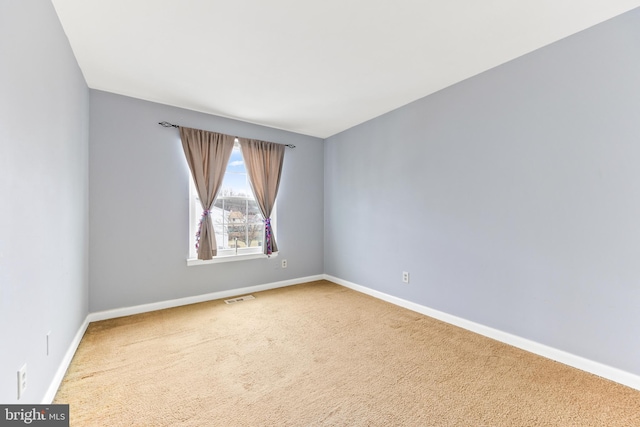 unfurnished room with carpet floors