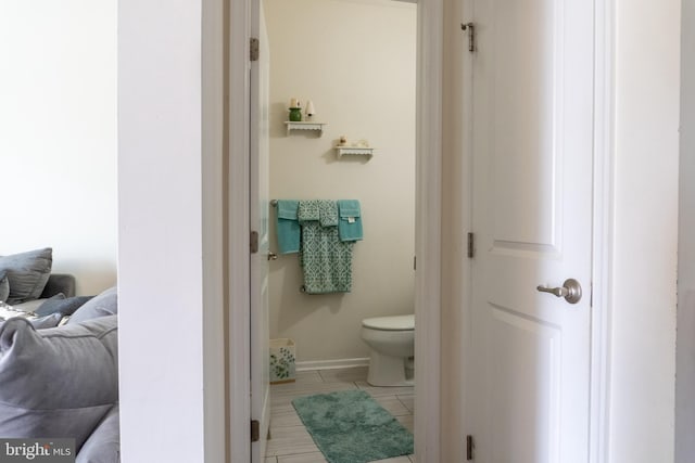 bathroom with tile patterned flooring and toilet