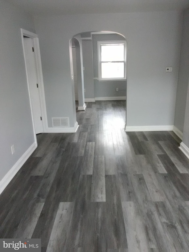 interior space with dark hardwood / wood-style floors