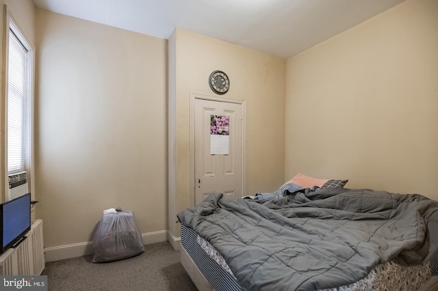 bedroom featuring carpet floors and radiator