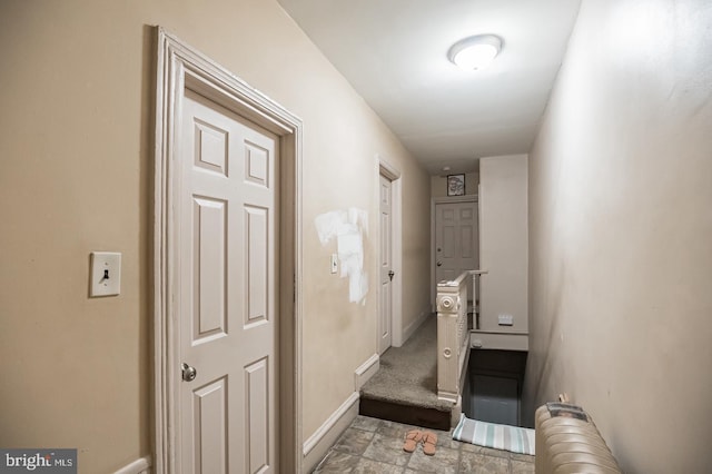 hallway featuring radiator heating unit