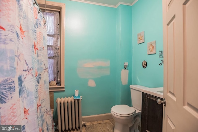 bathroom featuring vanity, radiator, ornamental molding, and toilet