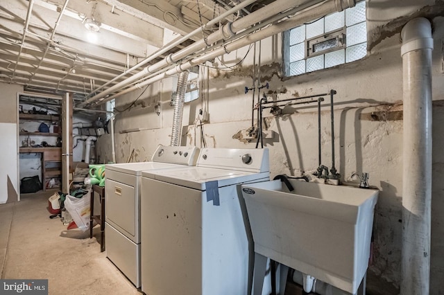 laundry room with sink and washing machine and clothes dryer