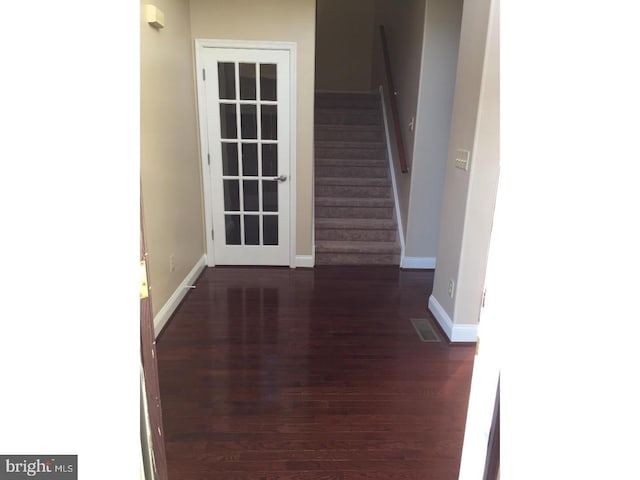 interior space with dark hardwood / wood-style floors