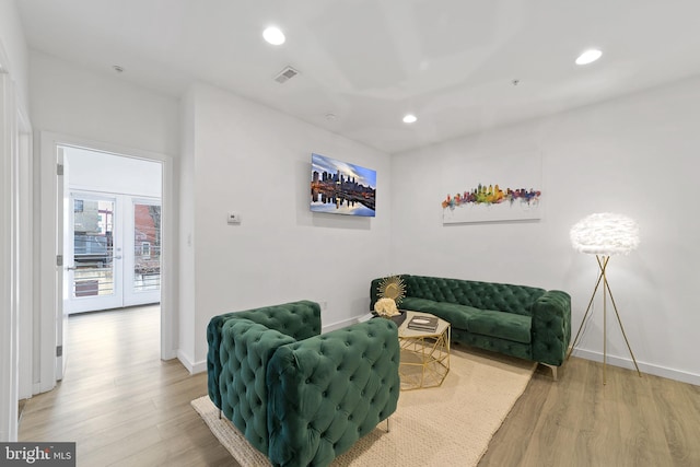 sitting room with hardwood / wood-style floors