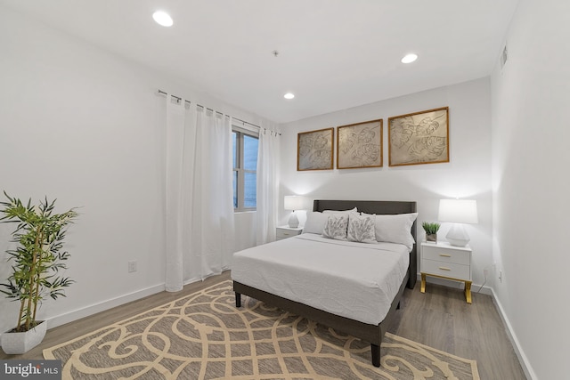 bedroom featuring hardwood / wood-style floors