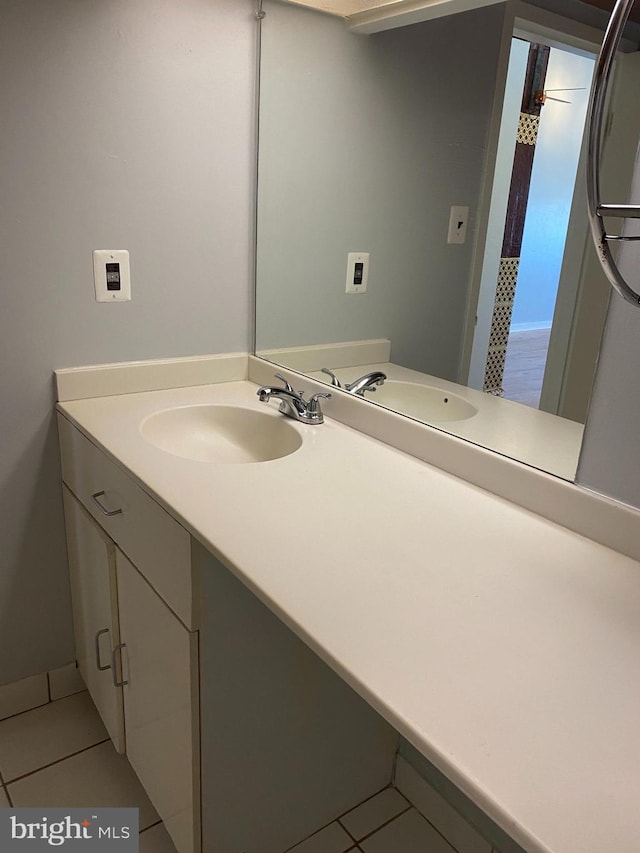 bathroom with vanity and tile patterned flooring