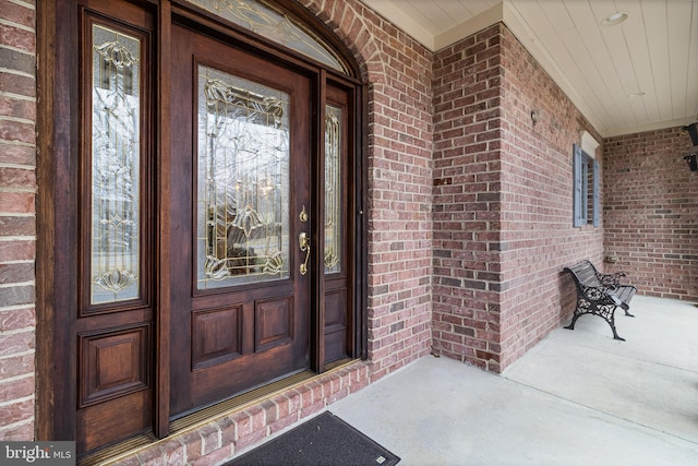 view of snow covered property entrance