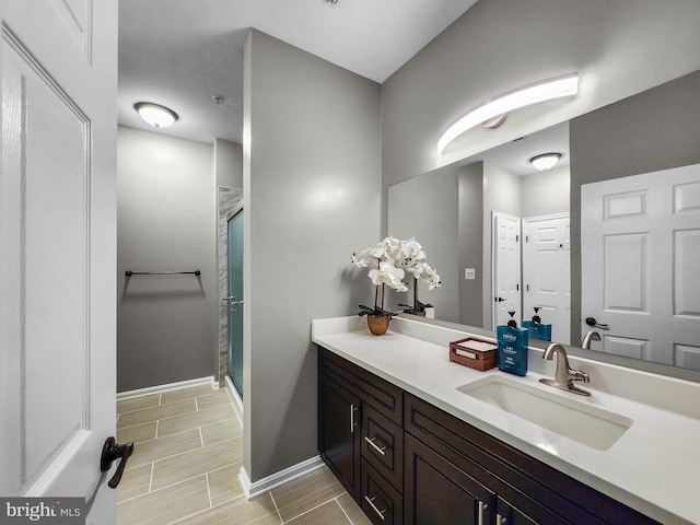 bathroom with vanity and an enclosed shower