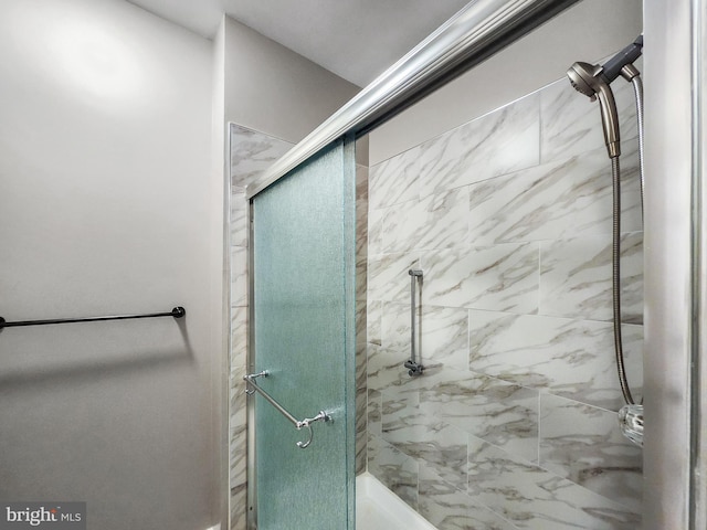 bathroom with a shower with shower door