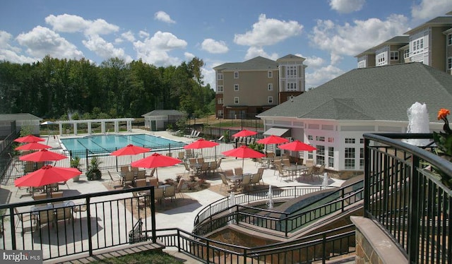 view of swimming pool featuring a patio