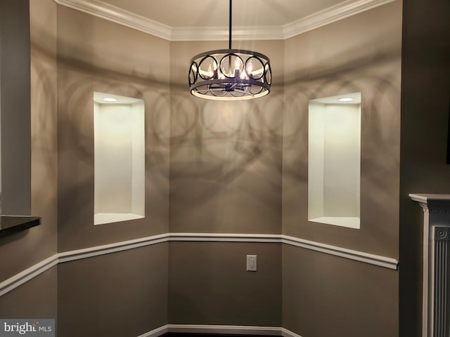 unfurnished dining area featuring crown molding and an inviting chandelier