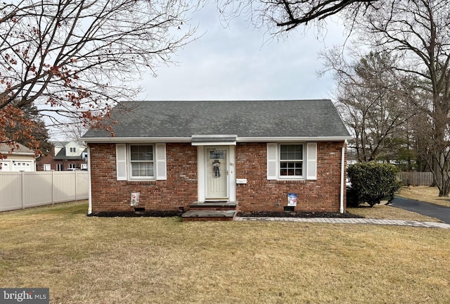 view of front of property with a front lawn