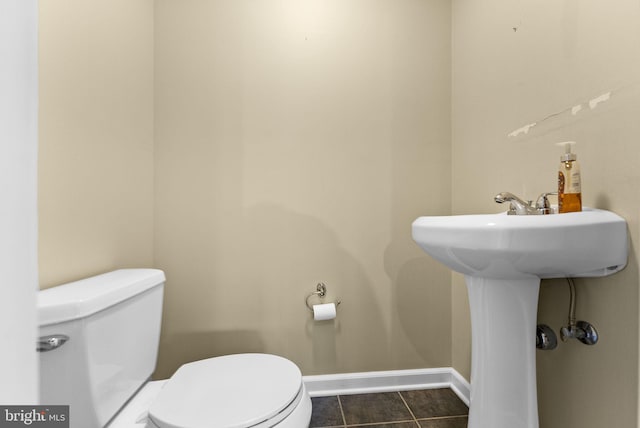 bathroom with tile patterned floors and toilet