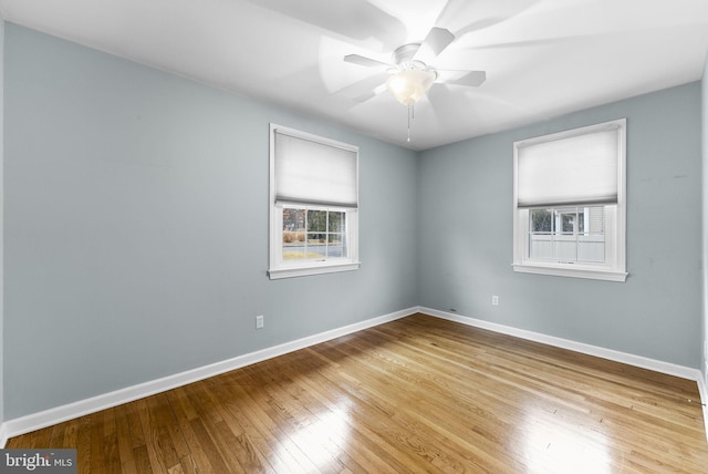 spare room featuring ceiling fan and light hardwood / wood-style flooring