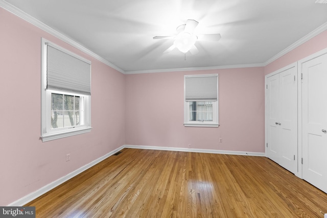 unfurnished bedroom with ornamental molding and light hardwood / wood-style flooring