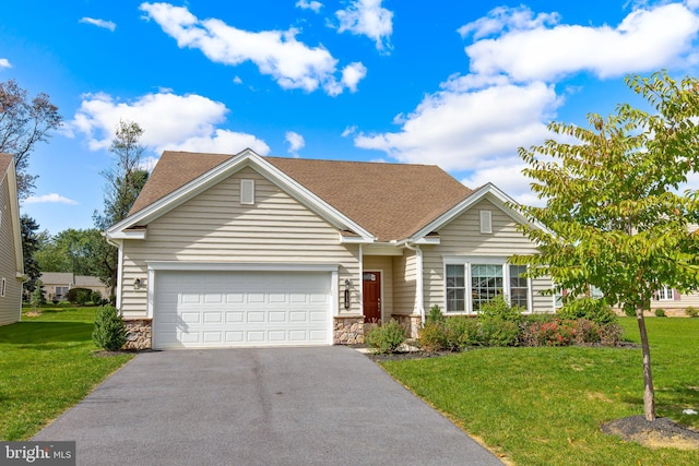 view of front of property featuring a garage and a front yard