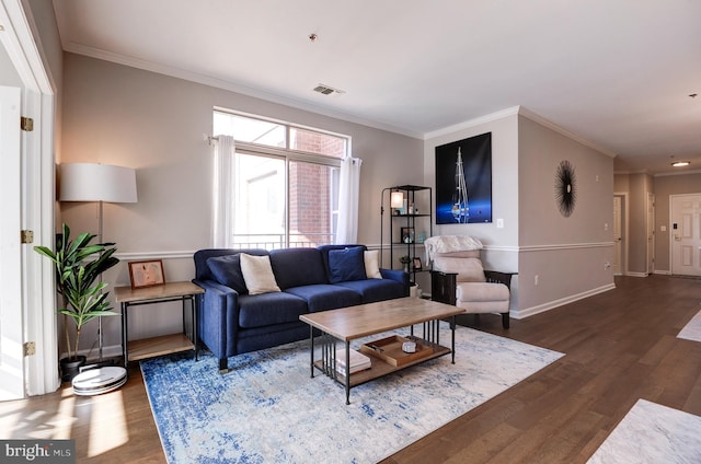 living room featuring dark wood-type flooring and crown molding