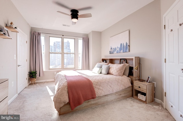 carpeted bedroom featuring ceiling fan